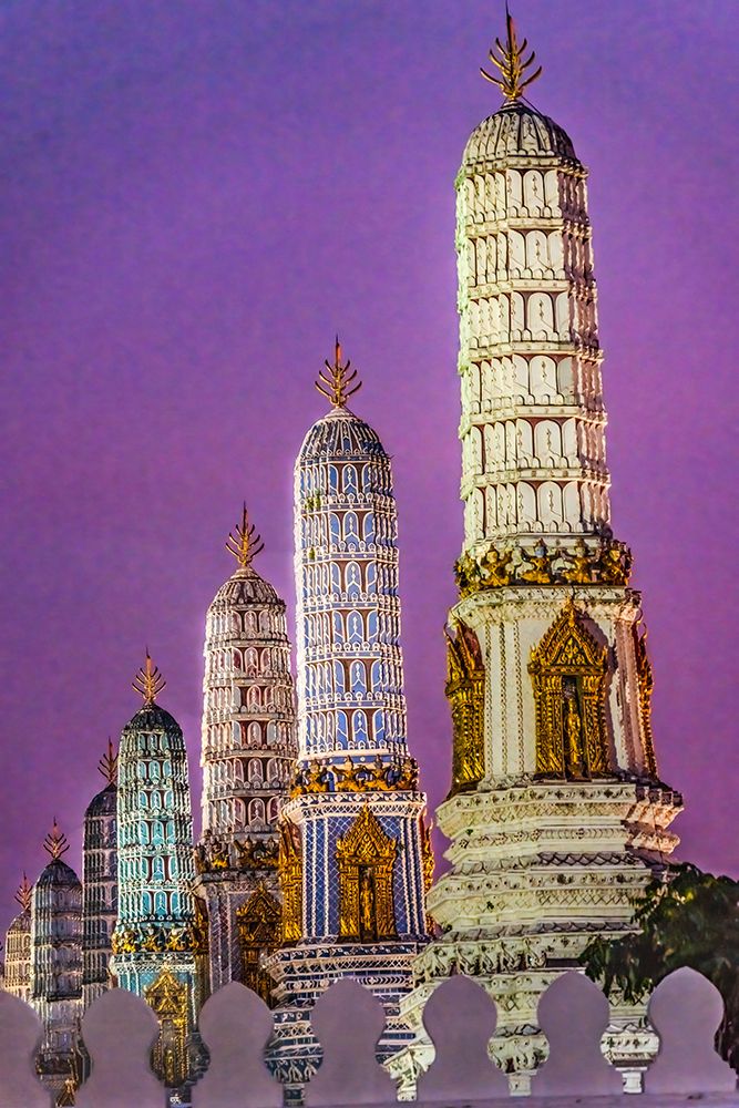 Colorful sunset Grand Palace, Bangkok, Thailand. Prangs represents different Buddhist Sects.